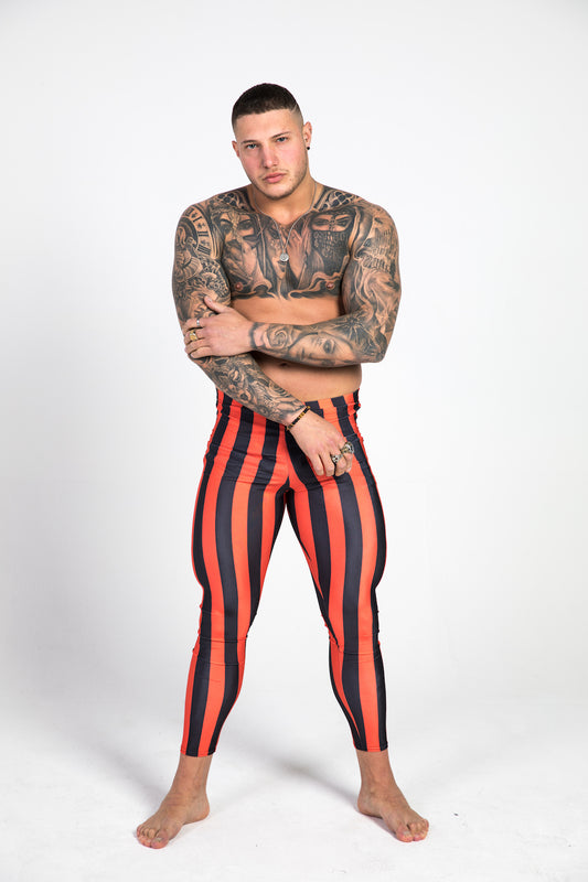 man wearing red striped leggings