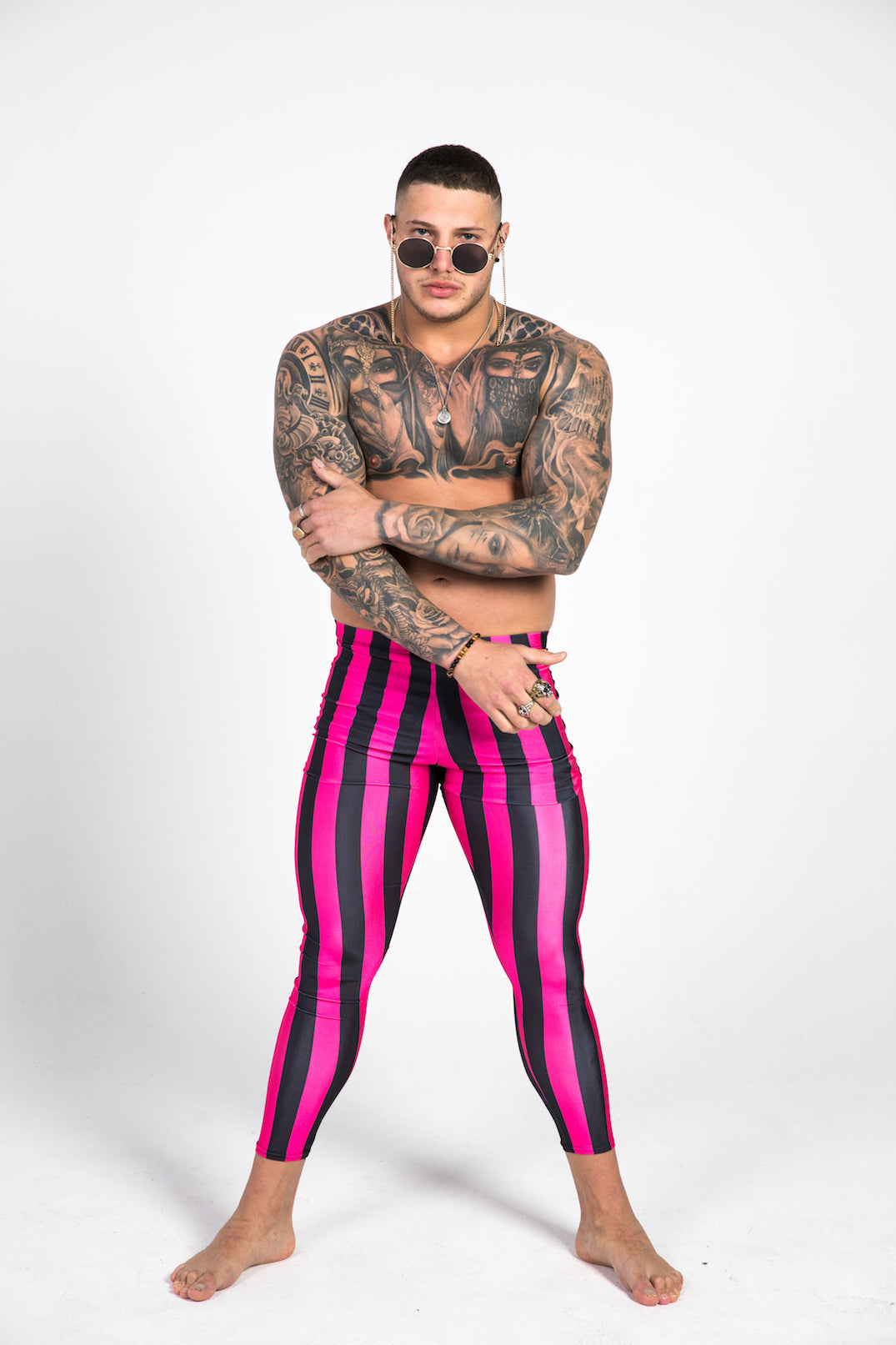 man wearing pink striped leggings