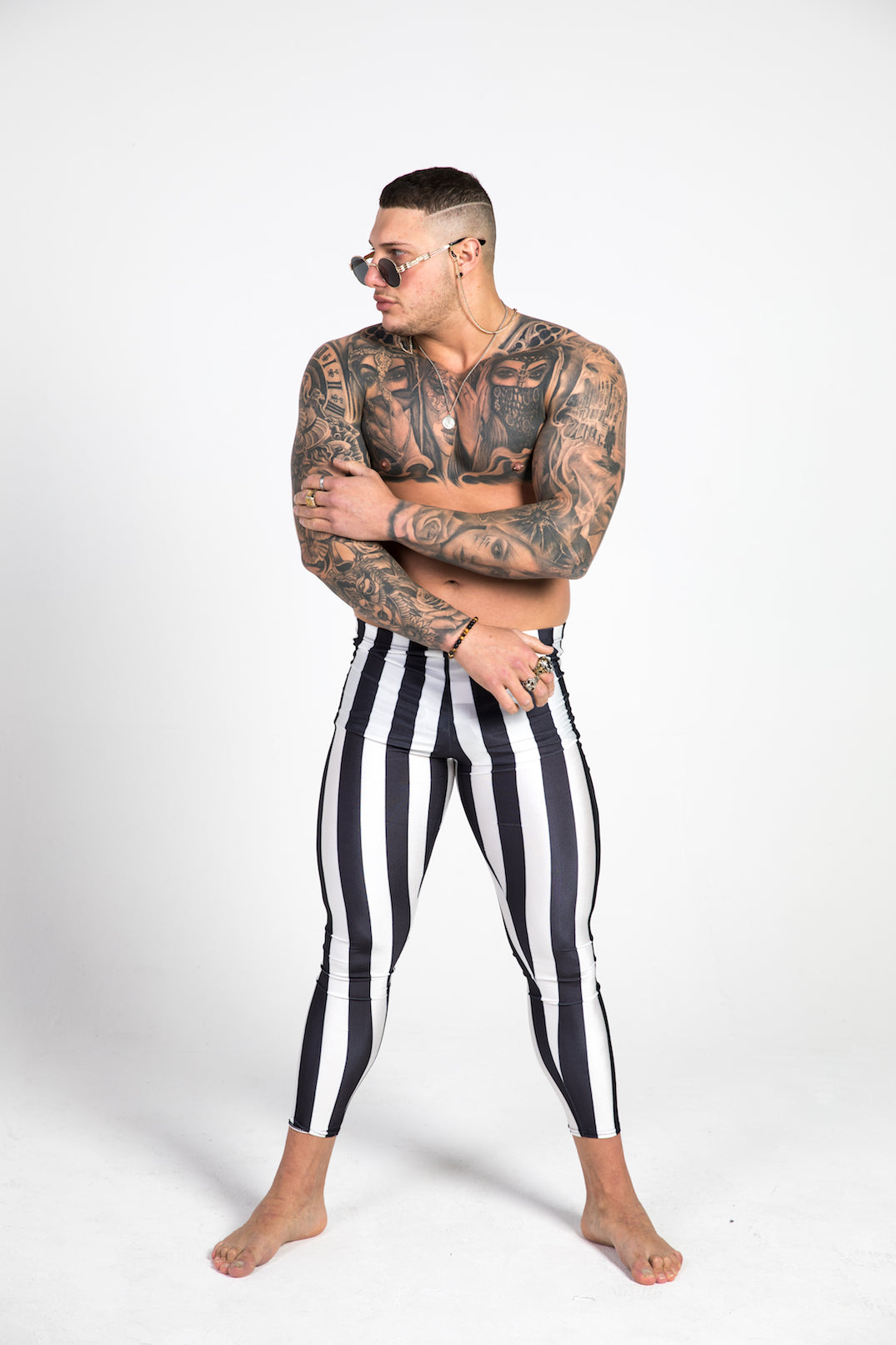 man wearing black and white striped leggings