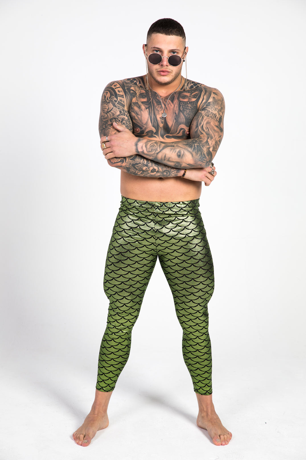 man wearing green fish scale leggings