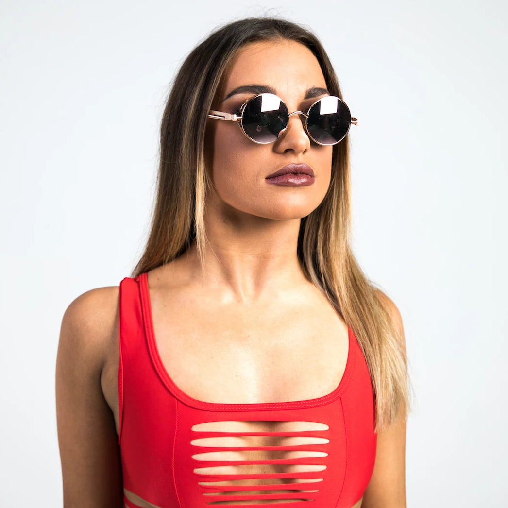 woman wearing rose gold sunglasses